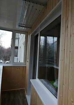 Остекление углового балкона с отделкой деревом в доме I-515/9Ш - фото 10